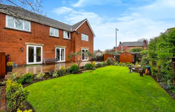 Cimla Court exterior and garden — Bold Cymru supported living home in Neath, South Wales